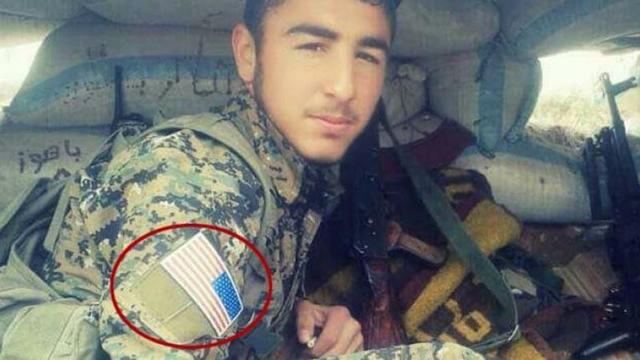 PYD militanlarının omzunda ABD bayrağı
